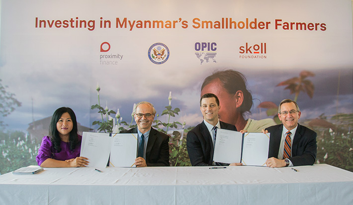 Sein New Oo, Head of Finance at Proximity Finance, Jim Taylor, co-founder and Chief Executive at Proximity Designs, Eric Jones, chief executive at OPIC, and Scot Marciel, U.S. Ambassador to the Republic of the Union of Myanmar, at the signing of a commitment at Proximity Designs’ Yangon office on April 3. 