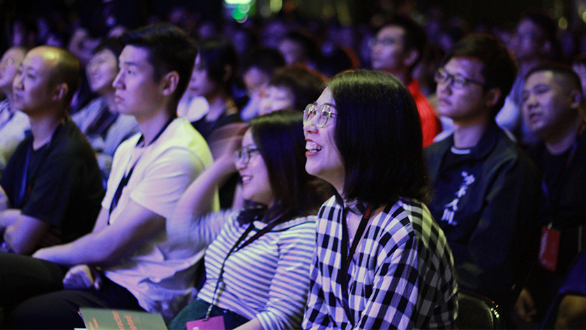 The audience at TEDxChengdu Skoll reacting to a speaker 