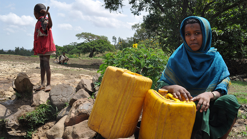 Photo of a family in Ethiopia collecting water