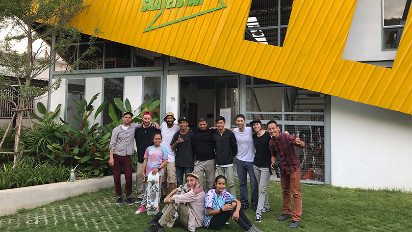 photo of the staffs of 7Hills and SkateQilya in front of the headquarters of Skateistan Cambodia