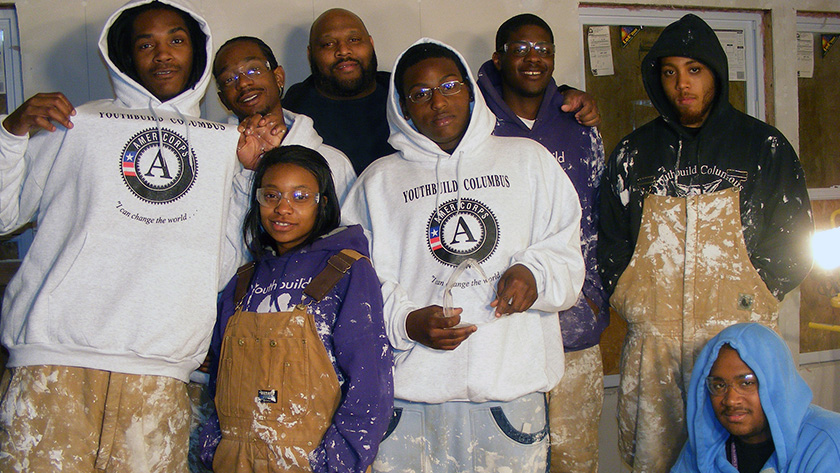 A photo of YouthBuild students in paint splattered work clothes in Columbus, Ohio