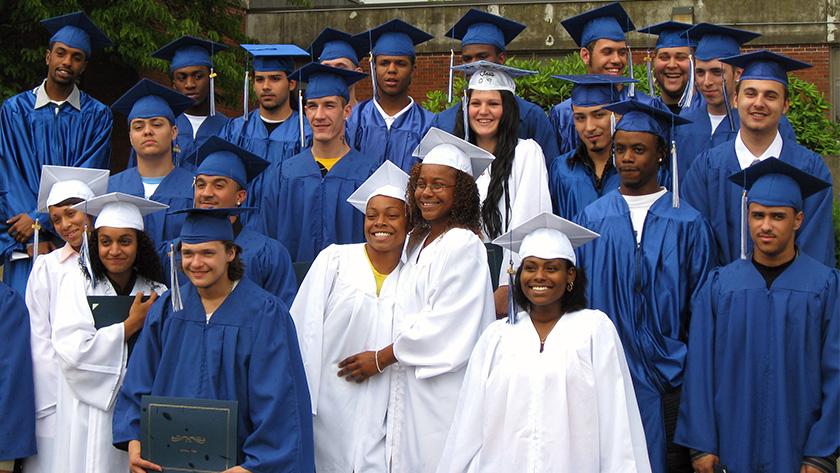 photo of 2009 YouthBuild graduates in cap and gown in Brockton, Massachusetts 
