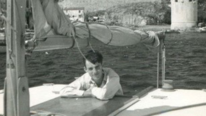 The author as a teenager in Corsica, leaning against the cabin of a sailboat.