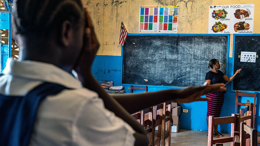 Monrovia, Liberia - A student participates in a vision screening exercise, conducted by Yvonne Jackson, a guidance counselor at the Monrovia Demonstration School.