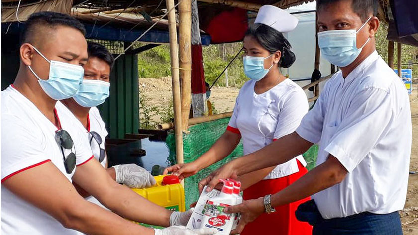 Young people distributing PPE supplies in Myanmar