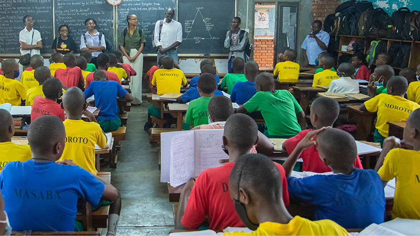 Solomon King Benge, Founder & Executive Director, Fundi Bots, speaking in front a group of students at a boys school